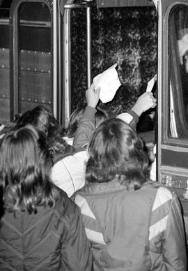 Fans stand near a bus to try to get autographs from Air Supply, St. Cloud State University