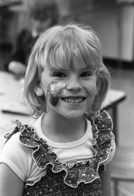 Girl with a painted face at the Gray Campus Laboratory School (1958), St. Cloud State University