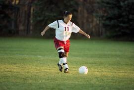 Kim Corbin kicks a soccer ball during a soccer game against Winona State, St. Cloud State University