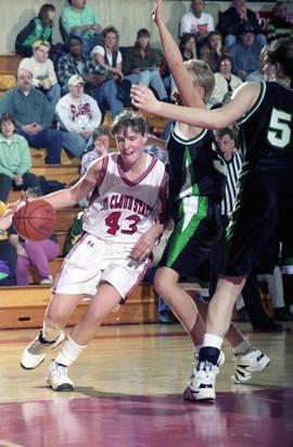 St. Cloud State women's basketball player Tina Schreiner dribbles the ball against the University of North Dakota