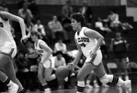 Dawn Anderson runs with a basketball during a game against the University of South Dakota, St. Cloud State University