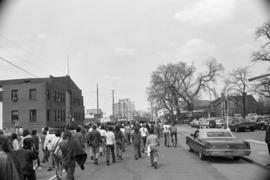 Protestors march on the street, Day of Peace protest, St. Cloud State University