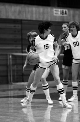 St. Cloud State basketball player Sue Wahl looks to pass during a game against the University of Minnesota at Halenbeck Hall (1965)