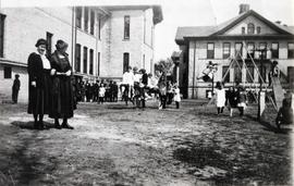 Children play at the Riverview (1913) playground, St. Cloud State University