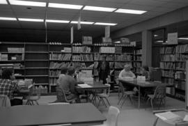 Kathy Farrell talks to students in the Curriculum Materials Laboratory, College of Education, St. Cloud State University