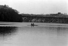 Rowing Club members row their boat on the Mississippi River, St. Cloud State University