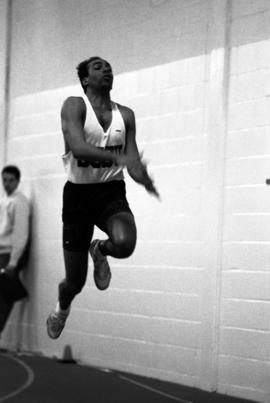 James White jumps during a track meet, St. Cloud State University