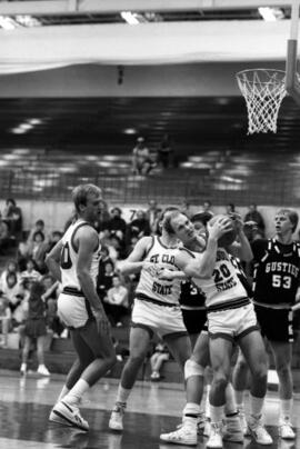 Basketball player Todd Spaulding grabs a basketball during a game against Gustavus Adolphus College, St. Cloud State University