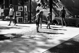 Children play on a sidewalk, Lemonade Concert and Art Fair, St. Cloud State University