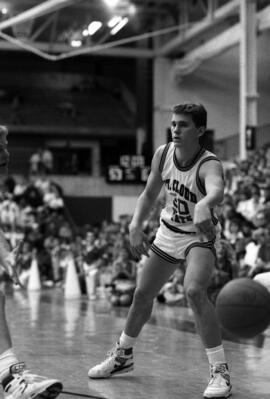 Eric Lind passes the basketball during a game against South Dakota State University, St. Cloud State University