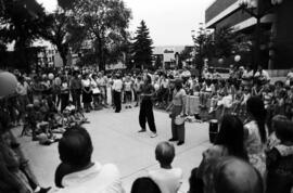 Two men entertain a crowd, Lemonade Concert and Art Fair, St. Cloud State University