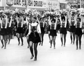 Cheerleaders march in a homecoming parade, St. Cloud State University