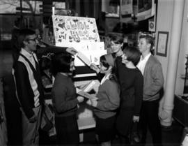 Don Boros and other students examine Boros cards for Valentine's Day, St. Cloud State University