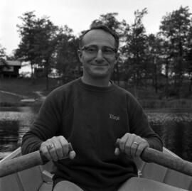 Max Partch rows a boat at a conservation workshop at Long Lake in Aitkin County, Minnesota, St. Cloud State University