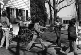 Theta Chi begins parade for Mississippi River crossing, St. Cloud State University