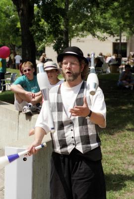 A man juggles pins, Lemonade Concert and Art Fair, St. Cloud State University