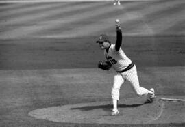 Baseball pitcher Pete Pratt throws a baseball, St. Cloud State University