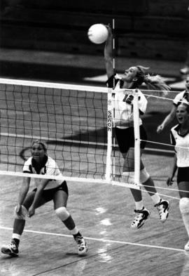 Cami Selbitschka spikes a volleyball during a volleyball match, St. Cloud State University