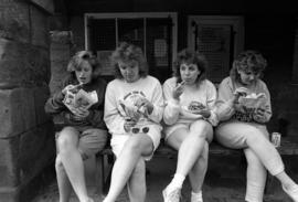 Women eat chips from the L&L's Chippy Ship in Alnwick, St. Cloud State University