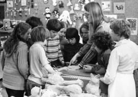 Students help a teacher Kathy Gerdts with a project, Gray Campus Laboratory School (1958), St. Cloud State University