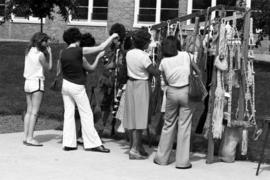 People inspect merchandise, Lemonade Concert and Art Fair, St. Cloud State University