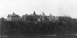 Lawrence Hall (1905), Old Main Building (1874), and the Old Model School (1906) from across the Mississippi River, St. Cloud State University