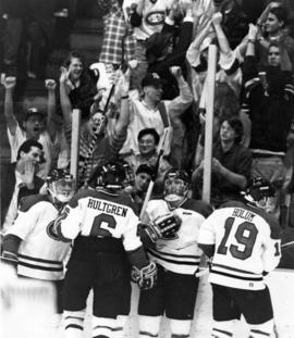 Hockey players celebrate a goal, St. Cloud State University