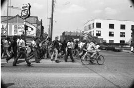 Protestors march on the street, Day of Peace protest, St. Cloud State University