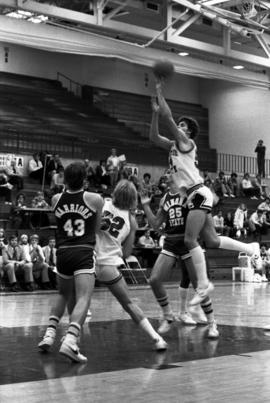 St. Cloud State University basketball player Dan Hagen shoots a basketball in a game against Winona State University