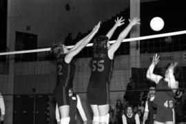 St. Cloud State volleyball players Rose Silbaugh and Kathy Justin block a shot during a match, St. Cloud State University