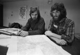 Rolf Hagberg and Dennis Caneff plan their trip down the Mississippi River, St. Cloud State University