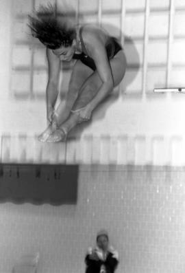 A diver competes during a swimming meet, St. Cloud State University