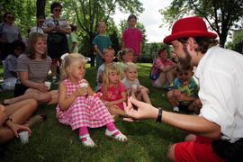 A man talks to children, Lemonade Concert and Art Fair, St. Cloud State University