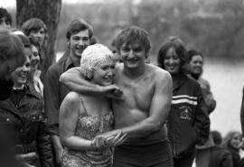 Vickie McLeary and Peter Noll celebrate after swimming across the Mississippi River, St. Cloud State University