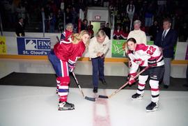 Man drops the ceremonial first puck at St. Cloud State's first women's hockey game