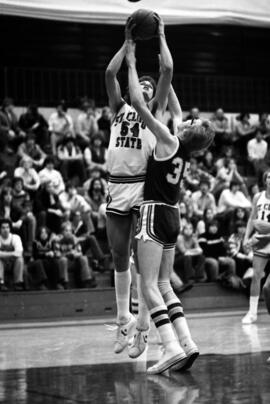 St. Cloud State University basketball player Dan Hagen grabs a basketball during a game against Bemidji State University