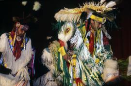 Two people dance at pow wow, St. Cloud State University