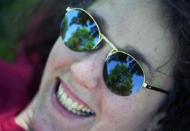 Woman wears sunglasses, St. Cloud State University