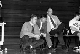 Coach Steve Grimit watches a wrestling match, St. Cloud State University