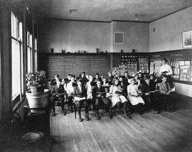 Children sit in a Riverview (1913) classroom, St. Cloud State University