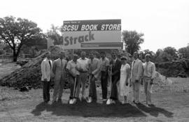 Tom Macgillivray, Robert Strack, Dick Ward, Bernie Lundstrom, Jack Amundson, Brady Watts, Bill Radovich, Rosie Moran, Mike Smith, and Brent Walz at the Bookstore groundbreaking, St. Cloud State University