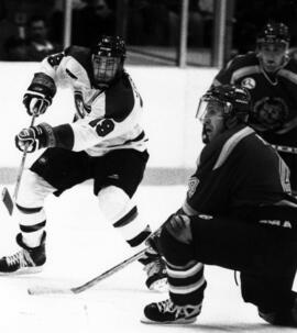 St. Cloud State University hockey player Jason Goulet takes a shot during a hockey game against Brandon University