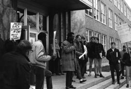 Man speaks to a crowd, St. Cloud State University