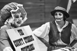 Two clowns advertise for the County Stearns Theatrical Company, Lemonade Fair, St. Cloud State University