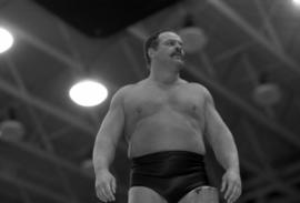 Wrestler Ron Bass prepares for his match at Halenbeck Hall (1965), St. Cloud State University