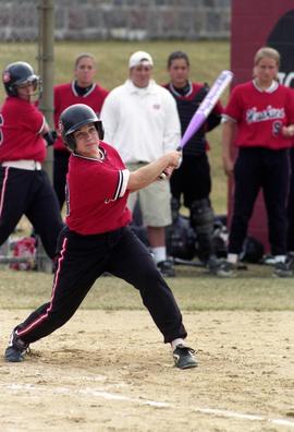 Softball player Mary Libbesmeier watches a batted ball during a softball game, St. Cloud State University