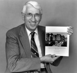 Ray Rowland with his book American Students in Alnwick Castle, 1981-1991: A Tenth Anniversary Perspective on St. Cloud State University's British Studies Program, St. Cloud State University