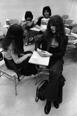 People gather togther in a classroom before a Shawn Phillips concert, St. Cloud State University