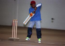 A man plays cricket, St. Cloud State University