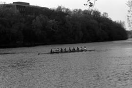 Rowing Club members row their boat on the Mississippi River, St. Cloud State University